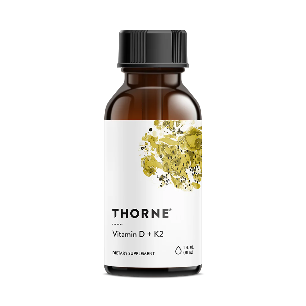 A bottle of Thorne Vitamin D3+K2 Liquid dietary supplement with a label showing a yellow and green floral design and text indicating the product name and dosage information.