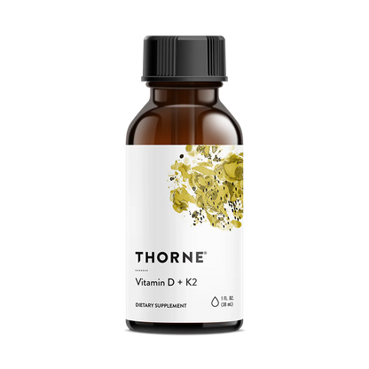 A bottle of Thorne Vitamin D3+K2 Liquid dietary supplement with a label showing a yellow and green floral design and text indicating the product name and dosage information.