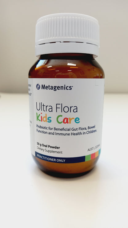 A bottle of Metagenics Ultra Flora Kids Care probiotic supplement for children, with branding and product information on the label.